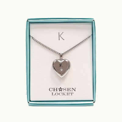 Heart-shaped necklace with 'K' pendant in a 'Chosen Locket' box on a white background