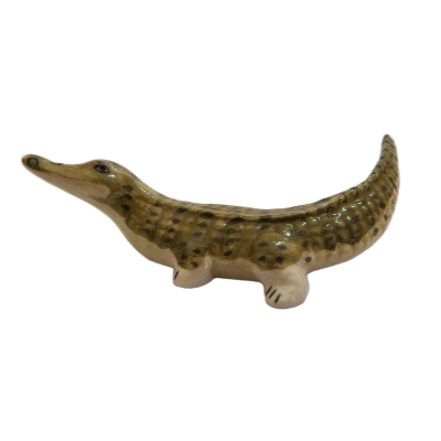 Ceramic crocodile figurine on a white background