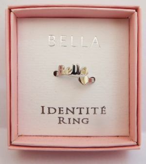 Ring with 'Bella' and 'Identité' text in a pink box