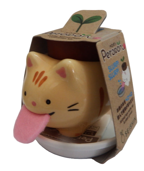 Cat-shaped plant product with a pink tongue on a white backgroundot 