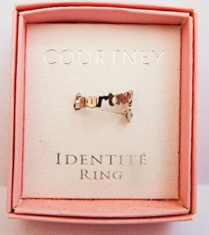 Gold ring in a pink box with 'Courtney' branding
