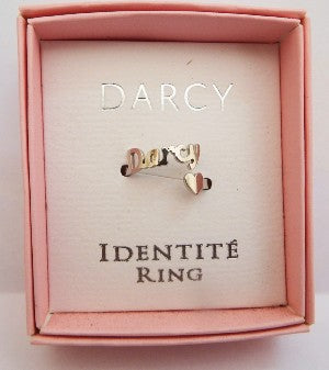 Identite Ring in a pink box with Name Darcy