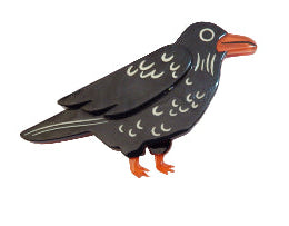 Black bird-shaped object with orange feet on a white background