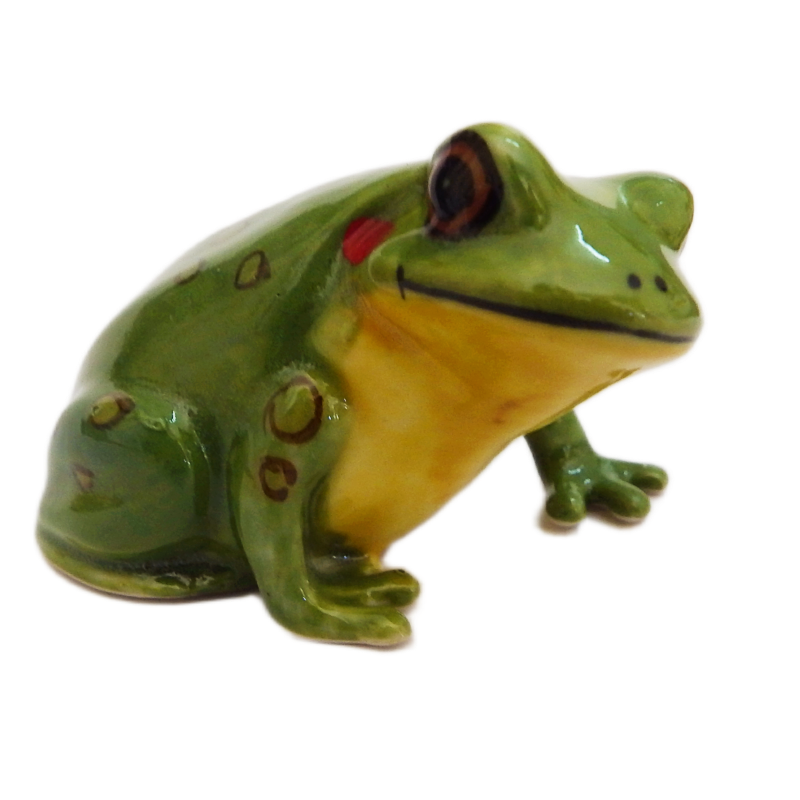 Green ceramic frog figurine with red eyes on a white background