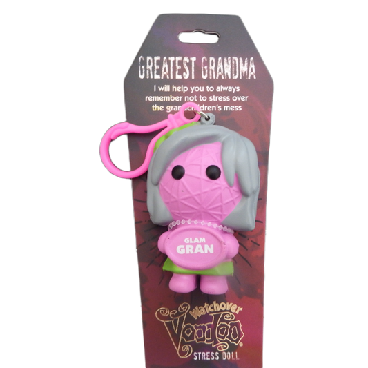 Stress doll with pink hair and green dress on a purple packaging background