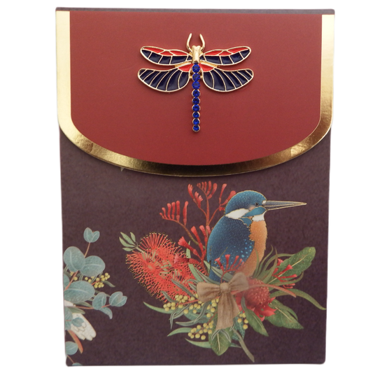 Bling Note Pad with a   kingfisher design with Australian native flowers on purple background. A decorative dragon fly on closing flap  with a red and gold border