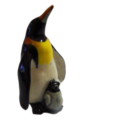 Glass penguin figurine on a white background