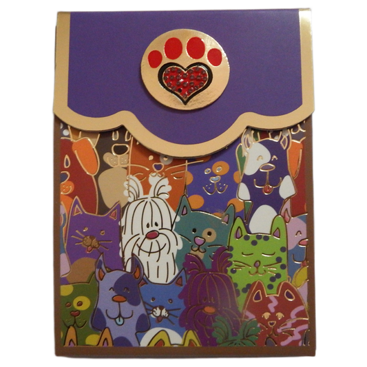Colorful cat-themed Bling note Pads with a decorative paw print emblem on a purple background