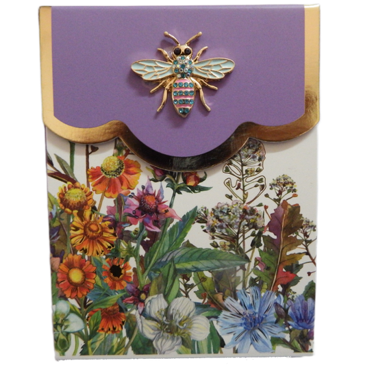 Floral-patterned Bling Purse pad with a decorative bee on a purple a white background with gold border fold down flap