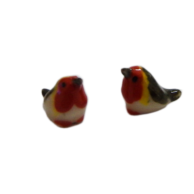 Two  porcelain mini robin red breast bird  figurines on a white backgrounded 