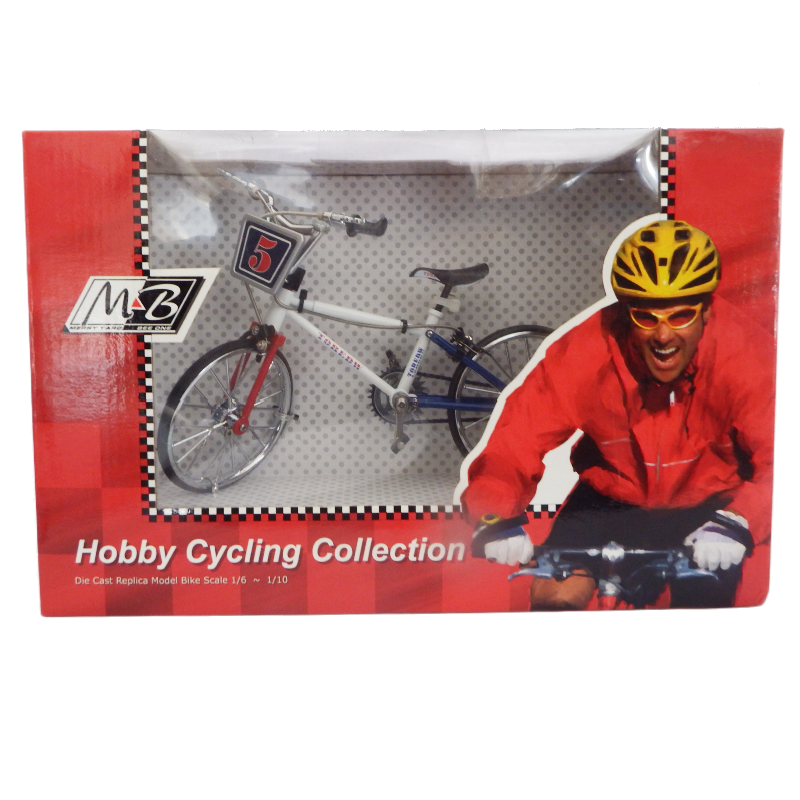 Model bicycle in packaging with cyclist illustration and M2B branding