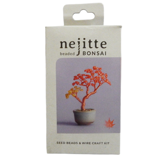 A product box for a 'nejitte beaded BONSAI' seed beads and wire craft kit. The packaging is off-white with a hanging tab at the top, featuring a central lavender panel with an illustration of a bonsai tree with orange-red and yellow seed beads in a pot.