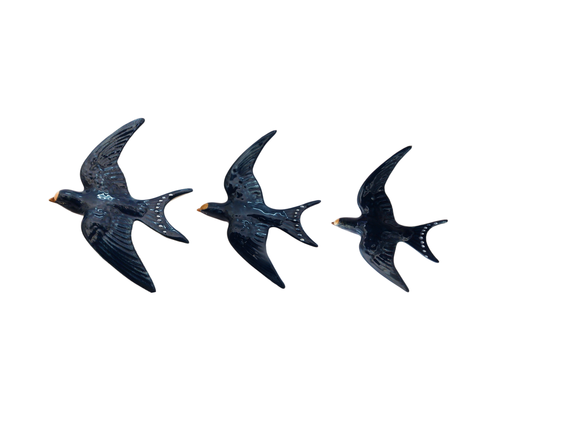 Three blue bird-shaped porcelain  Wall Swallow decorations on a white background