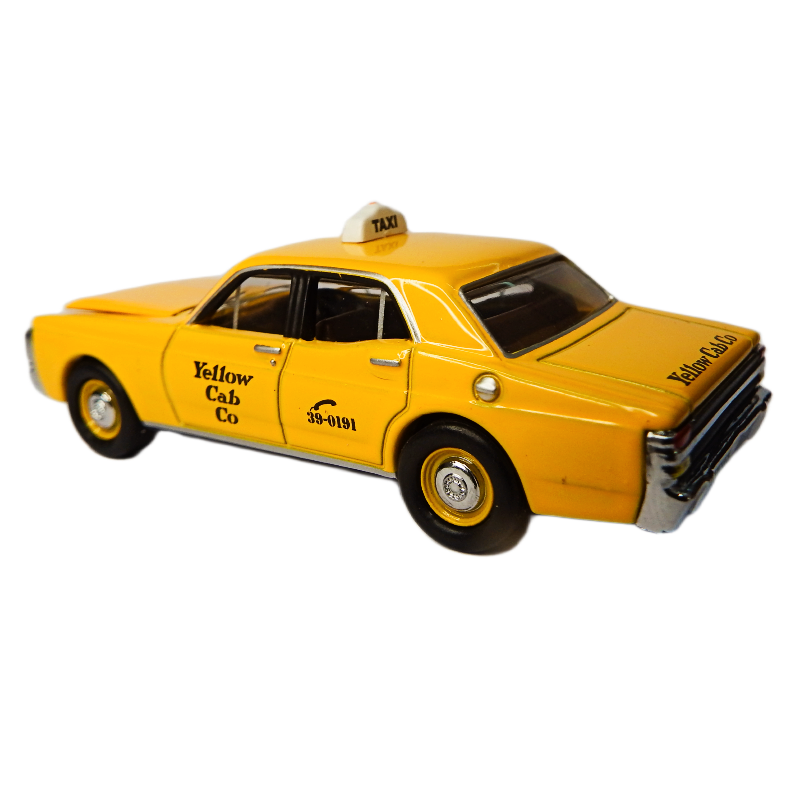 Model of a yellow taxi cab with 'Yellow Cab Co' branding on a white background