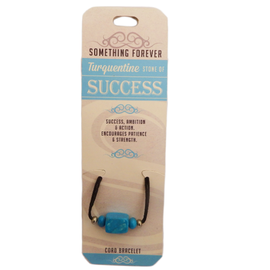 A turquoise beaded bracelet on an elastic band, packaged on a card text 'Turquoise', 'Success', 'Ambition', Encourages patience & strength.