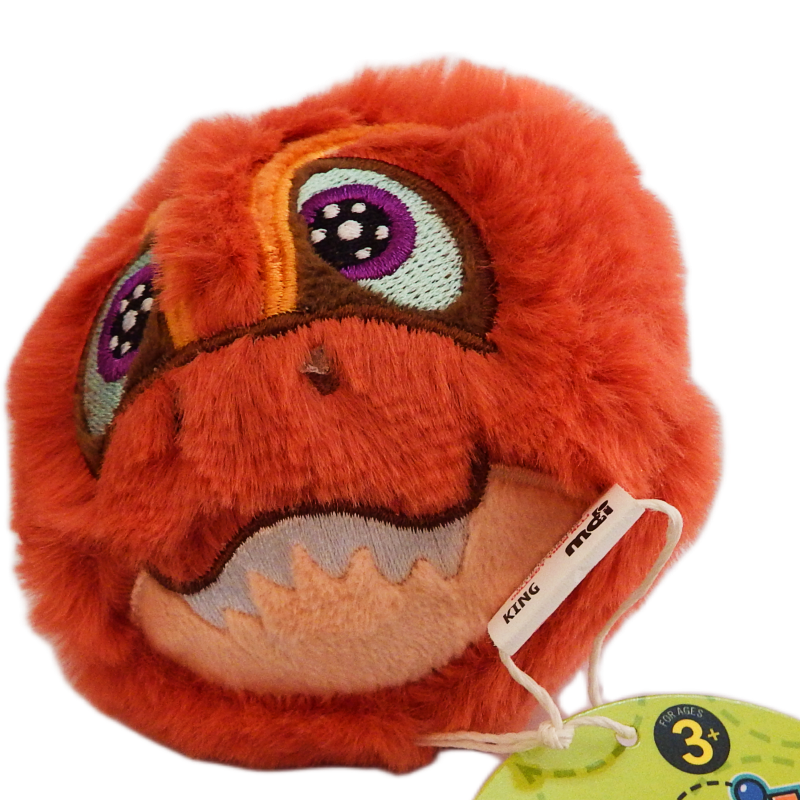 Red plush toy with a tag on a white background