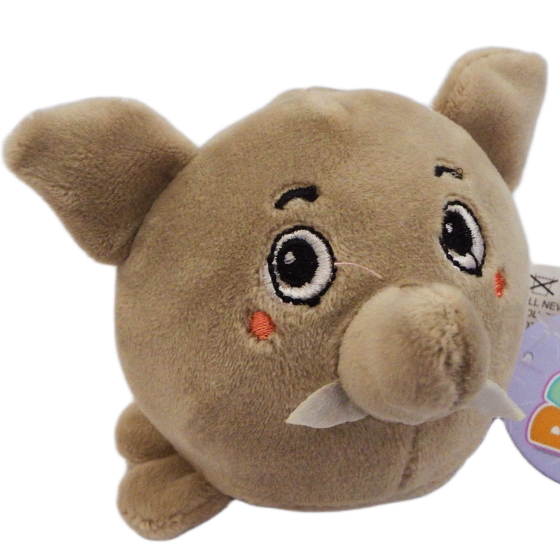 Plush toy resembling an elephant a  grey animal with big ears and a trunk a tag on a white background
