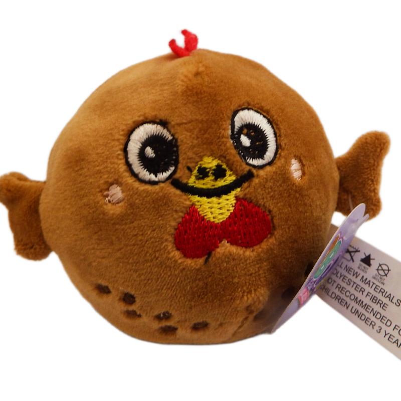 Plush toy resembling a brown chicken with a smiling face on a white background