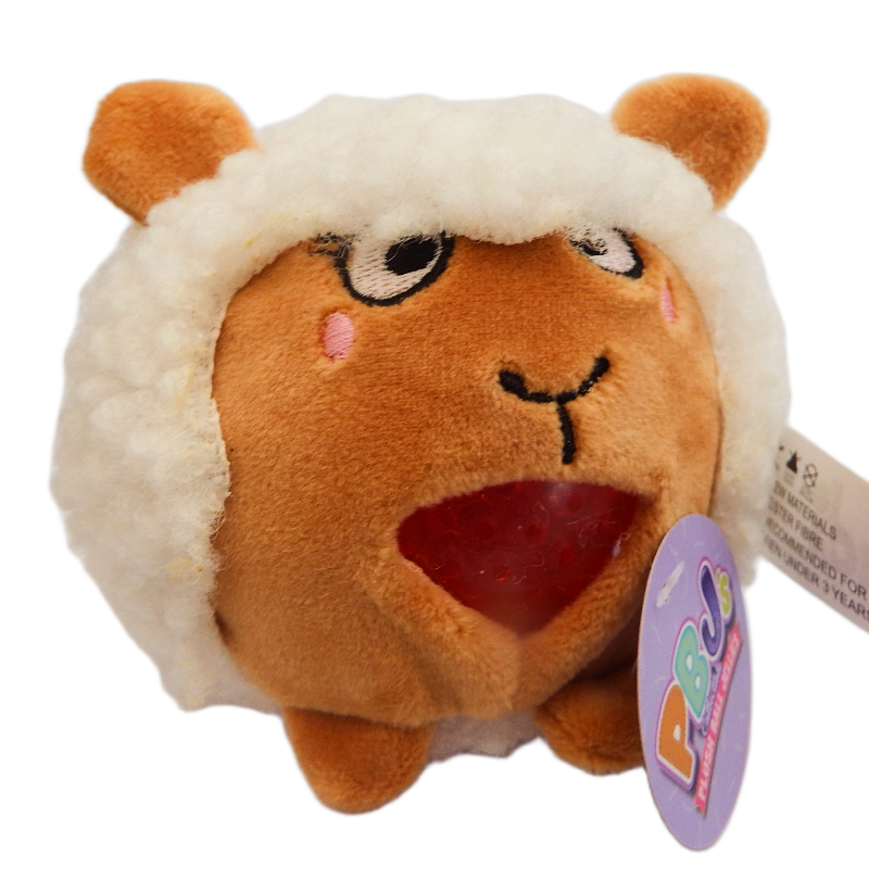 Plush toy resembling a sheep with a tag on a white background