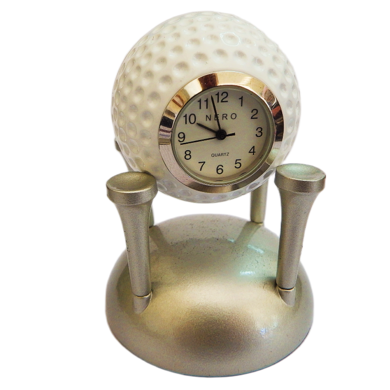 image golf ball nero clock suporded by silver tees on white background