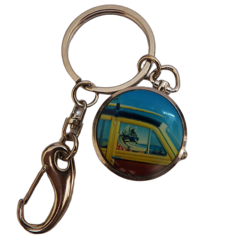Keychain with a circular pendant clock featuring a scenic design on a white background
