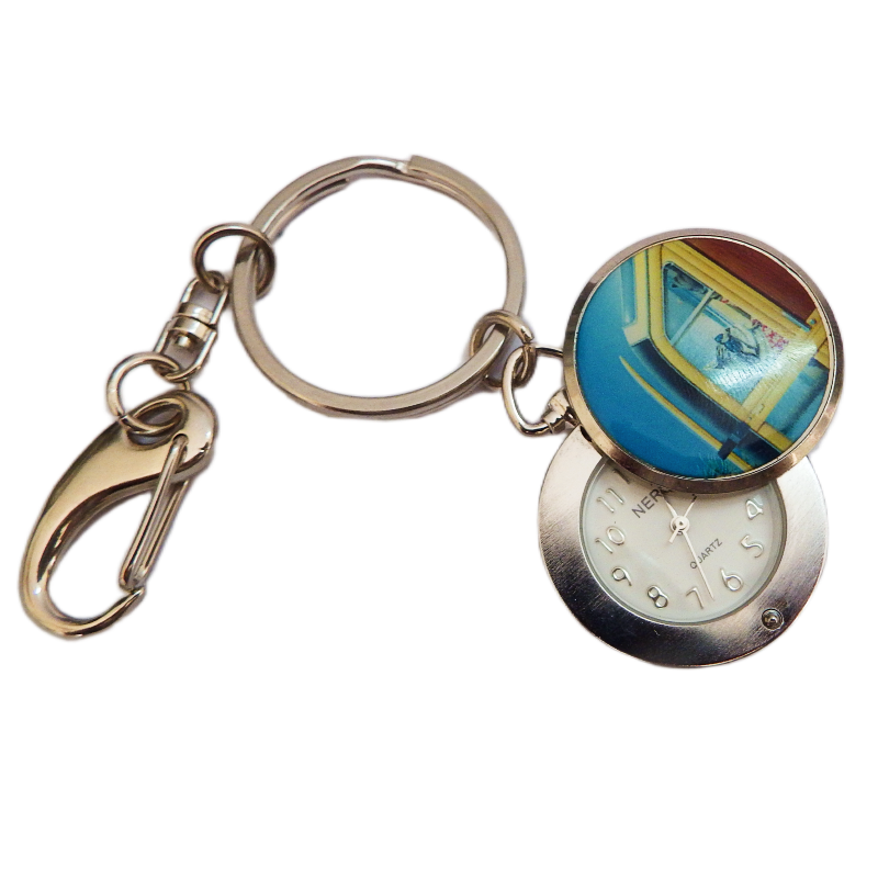 Keychain with a round keyring and a pocket watch face on a white background