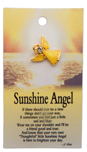 Gold angel brooch on a card with 'Sunshine Angel' text and ocean background