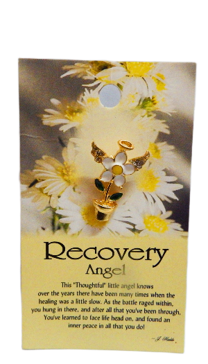 Gold angel pin on a card with flowers and text