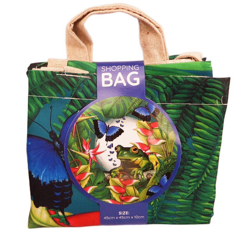 Tropical-themed shopping bag with a colorful design featuring butterflies green tree frog and plants, on a white background.