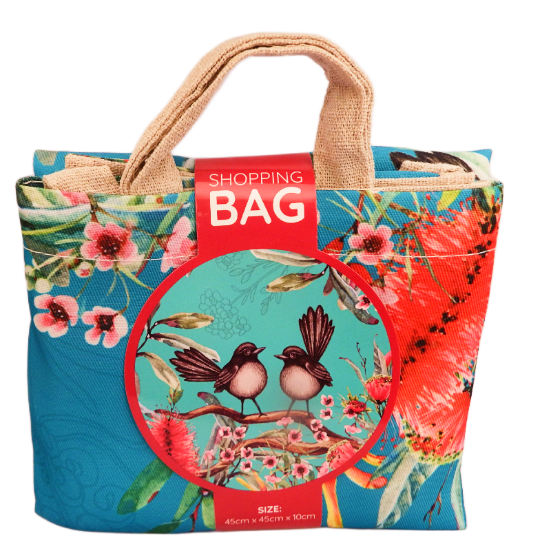 Colorful shopping bag with willy wagtail bird and floral design on a white background