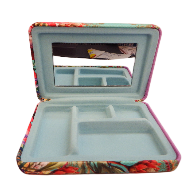Jewelry box with mirror and compartments on a white background