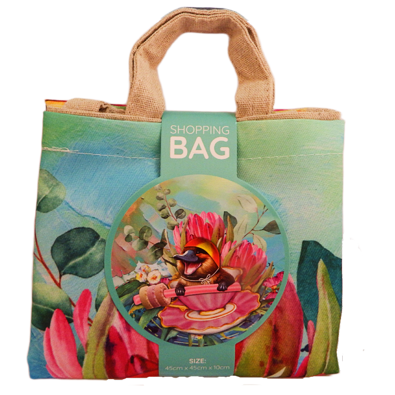 Colorful shopping bag with a design of a platypus and flowers, featuring a tag labeled 'Shopping Bag'.