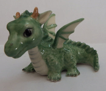 green Dragon miniatre figurine on white background