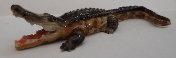 salt water crocodile figurine on white background