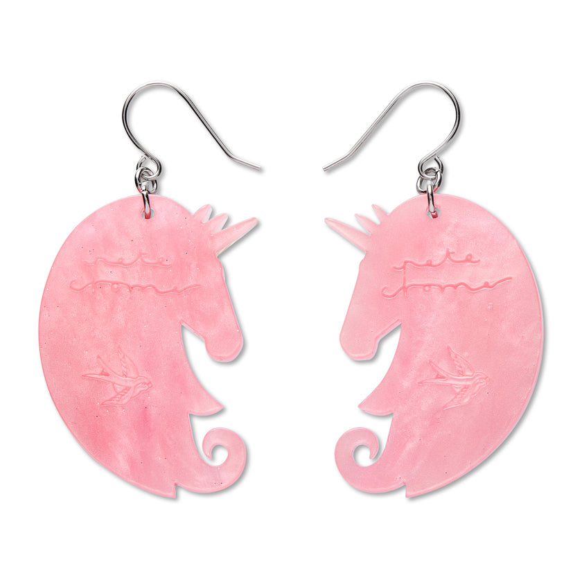 back  of  unicorn earrings with erstwilder logo and pete cromer signature etched into back