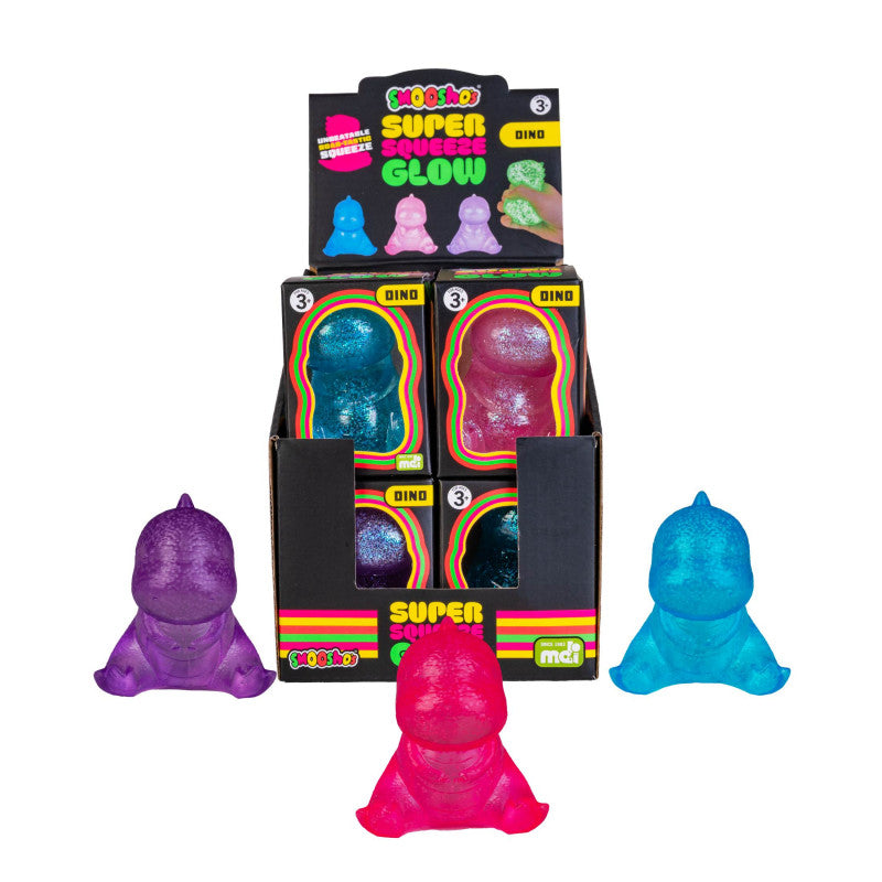 Display of colorful glow-in-the-dark dinosaur toys with packaging on a white background