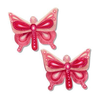 Two pink butterfly-shaped hair clips on a white background