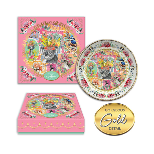 Decorative plate with Australian animal & Bird  postage stamp designs  with a floral boarder and matching box on a white background