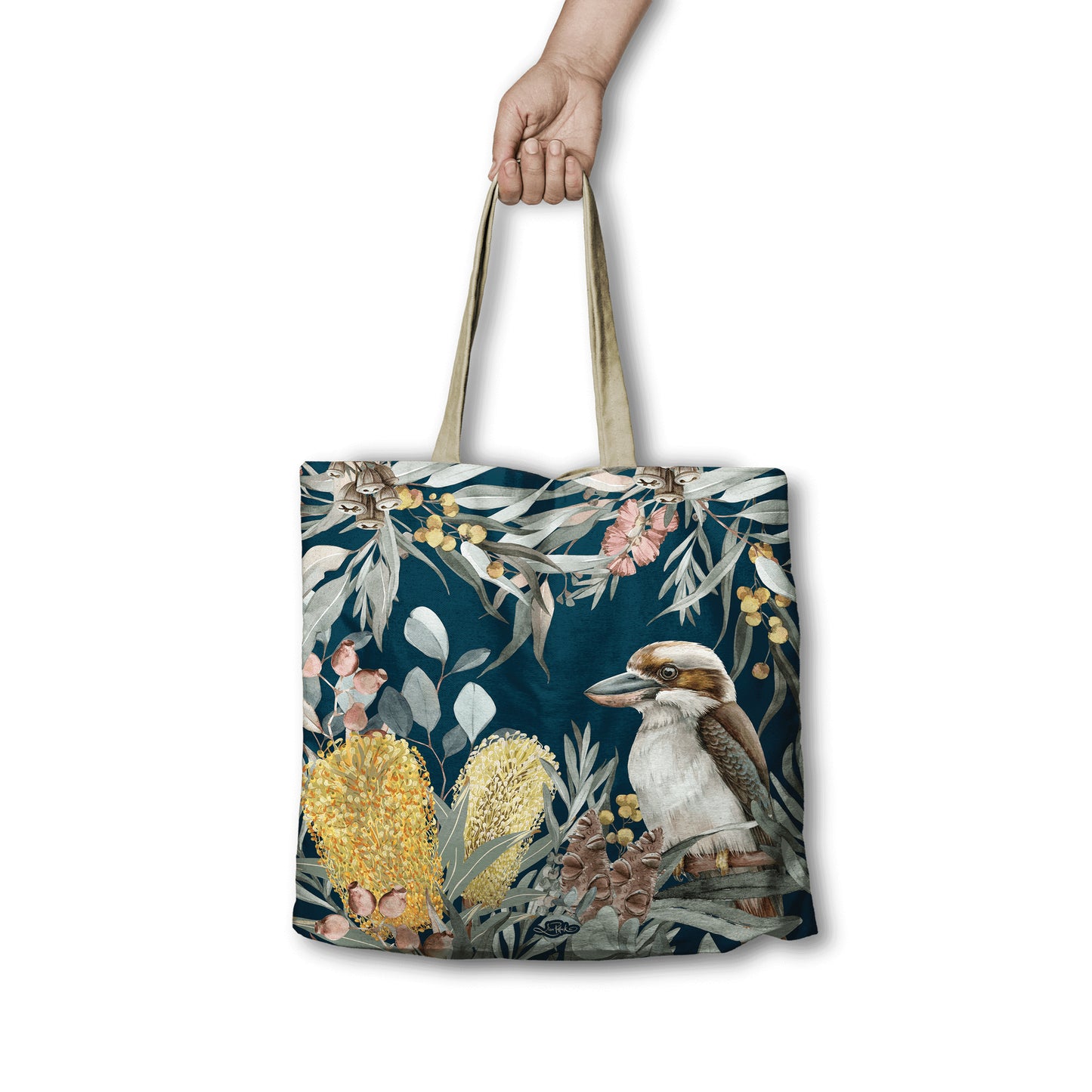 Tote bag with a kookaburra and floral design held by a hand on a white background