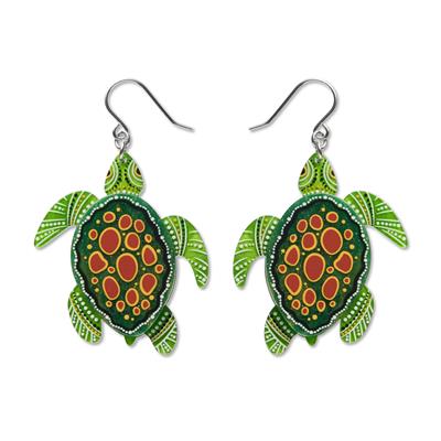 Turtle-shaped earrings with green, orange, and white design on a white background