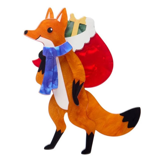 Plush fox toy with a red cape and blue scarf on a white background