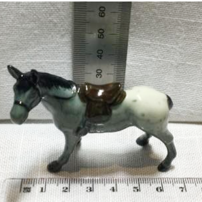 horse with saddle and bridal porcelain figurine