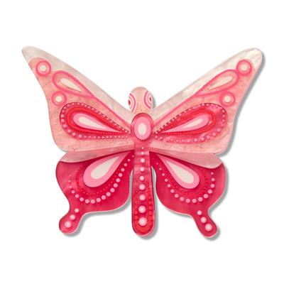 Decorative pink butterfly with white accents on a white background