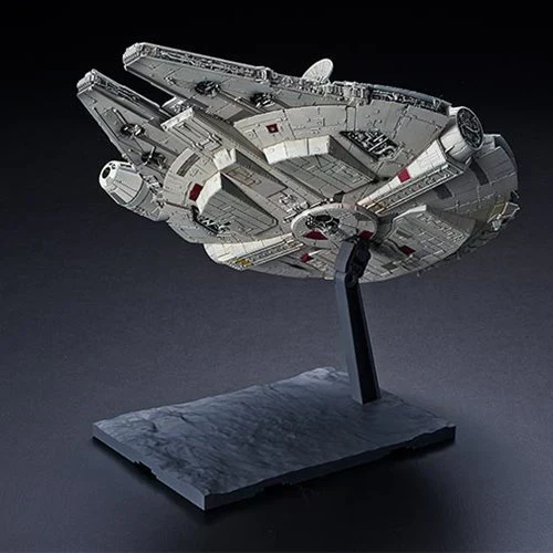 Model of a spaceship on a stand against a dark background