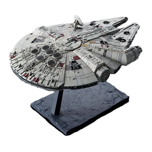 Model of the Millennium Falcon spaceship on a stand with a white background