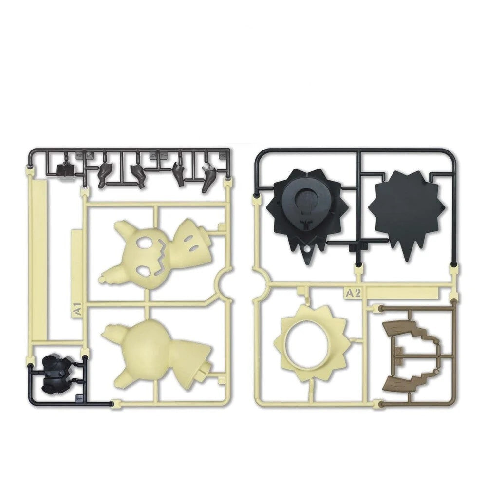 Two unpainted plastic sprues for a model kit, featuring light beige and dark gray molded parts on a clean white background.