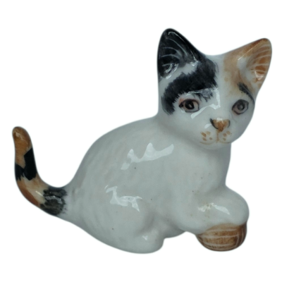 Porcelain Brown and White Kitten Sitting with Ball