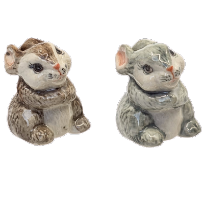 Two ceramic rabbit figures on a white background