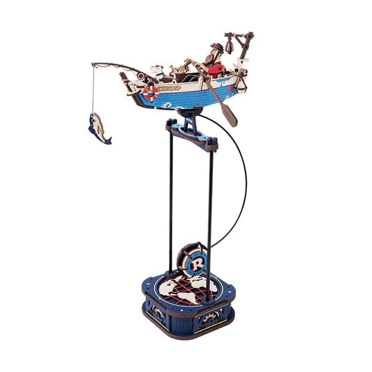 Rokr Gravity Swing Ocean Fisher Decorative model of a fishing boat on a stand with a white background