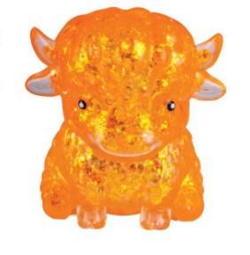 An orange glittery bull figurine with small horns and black eyes, shown against a plain white background.